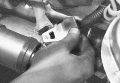 Снимите наконечник троса