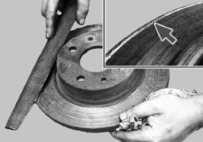 снимите с обеих его сторон напильником буртики